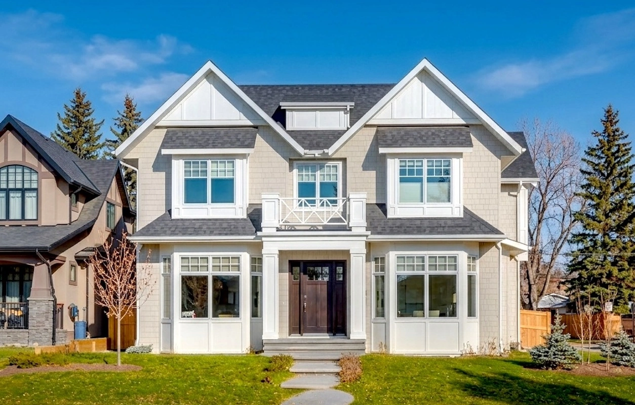 Briar Hill Calgary custom home exterior featuring James Hardie® shake siding, SmartBoard® trim systems, and architectural wood accents by Rhino Exteriors