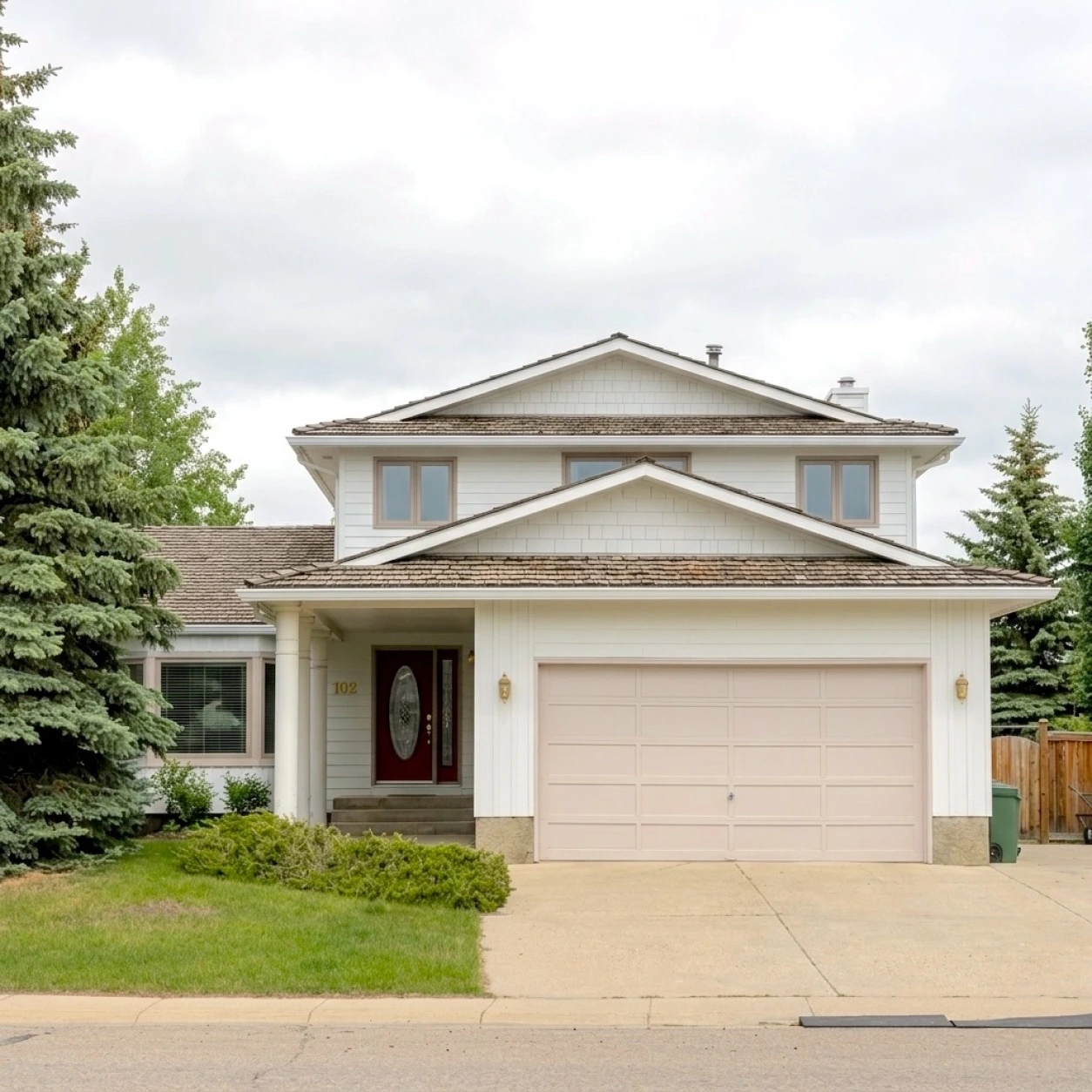 Exterior renovation project in Woodhaven Okotoks completed by Rhino Exteriors featuring premium siding, roofing upgrades, and exterior cladding improvements